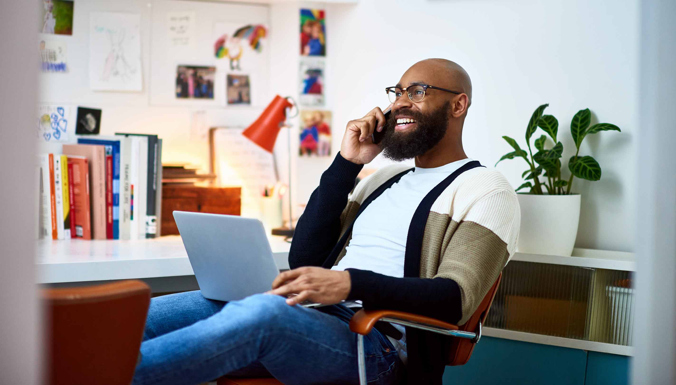 Man smiling as he works from a modern home office
